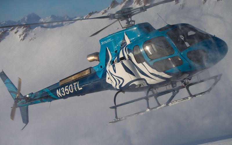 heli-ski-helicopter-taking-off-from-slope-min