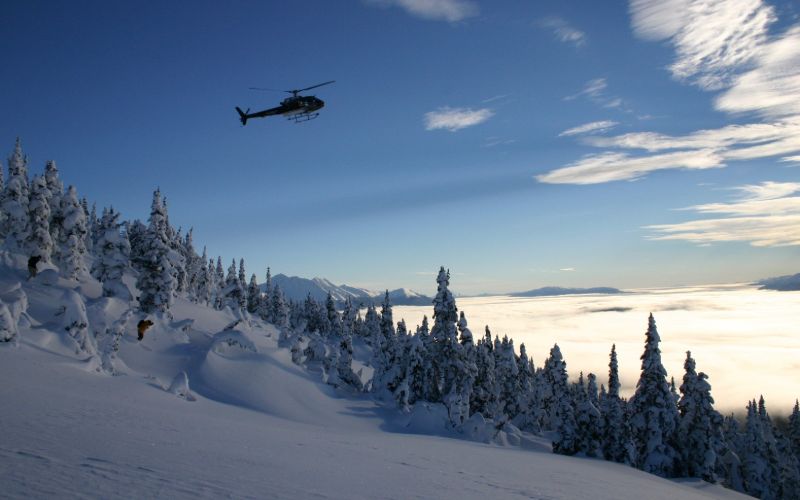 affordable-heli-ski-helicopter-flying-min