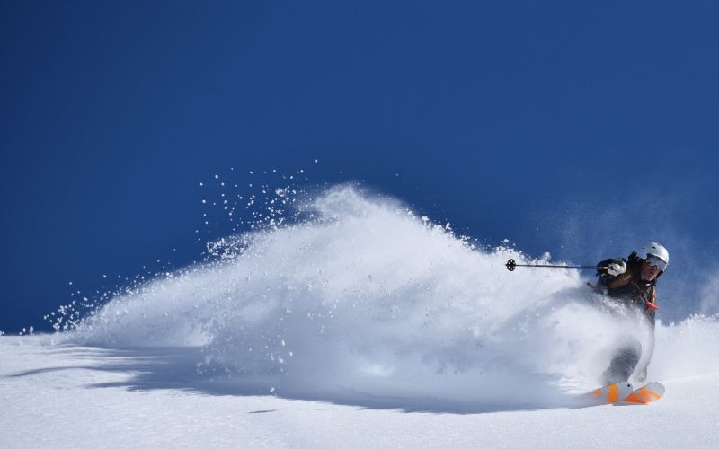 heli-skiing-bc-prices-man-skiing-min
