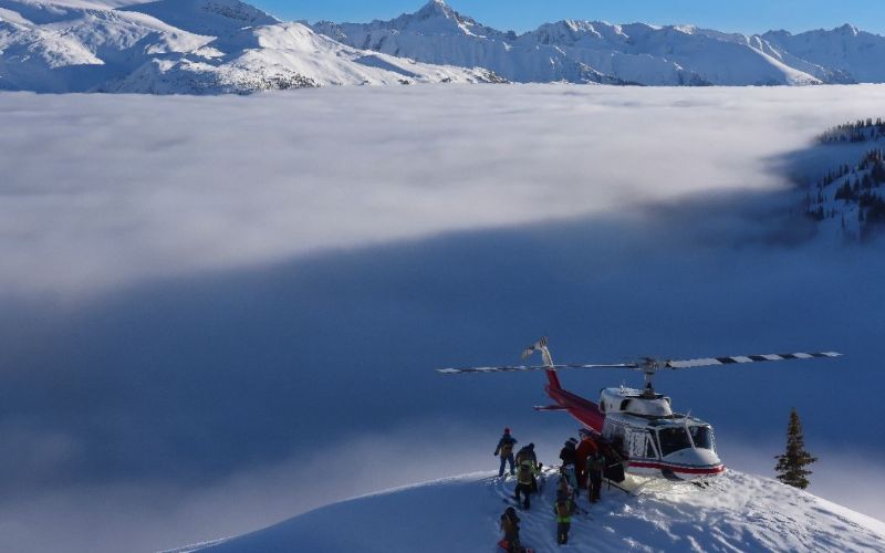 affordable-heli-skiing-helicopter-landing-min