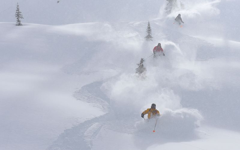 heli-skiing-bc-prices-three-skiers-min