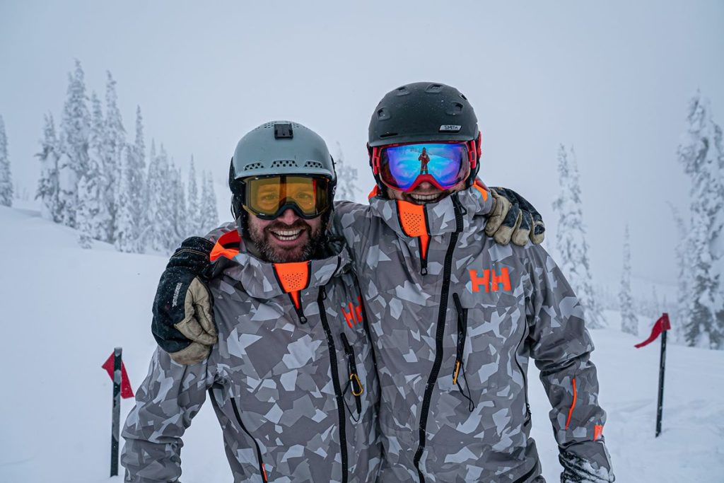 heliskiing-canada-prices-two-people-posing-min